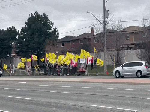 Khalistanis gathered outside Triveni Temple in Canada and police vehicles stationed there.