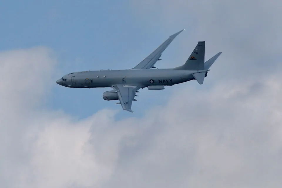 A Boeing P-8-A Poseidon flies on display during Farnborough International Air Show, Farnborough, England, Tuesday, July 15, 2014.