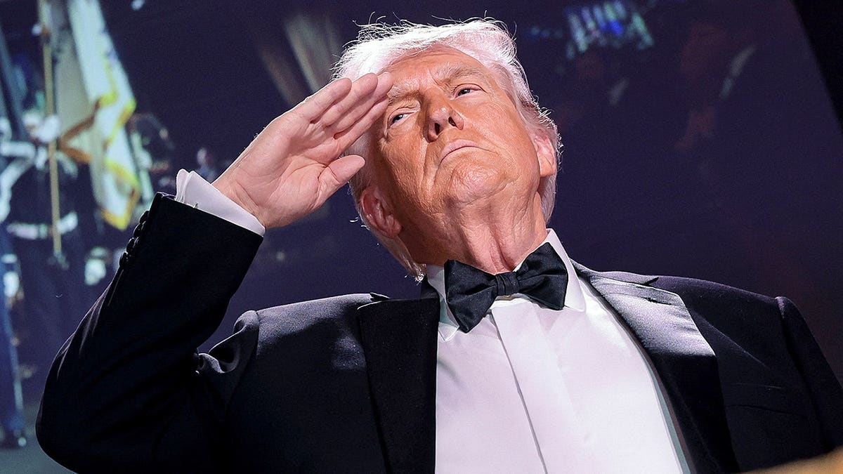 U.S. President Donald Trump saluting at the White House Correspondents' Association dinner
