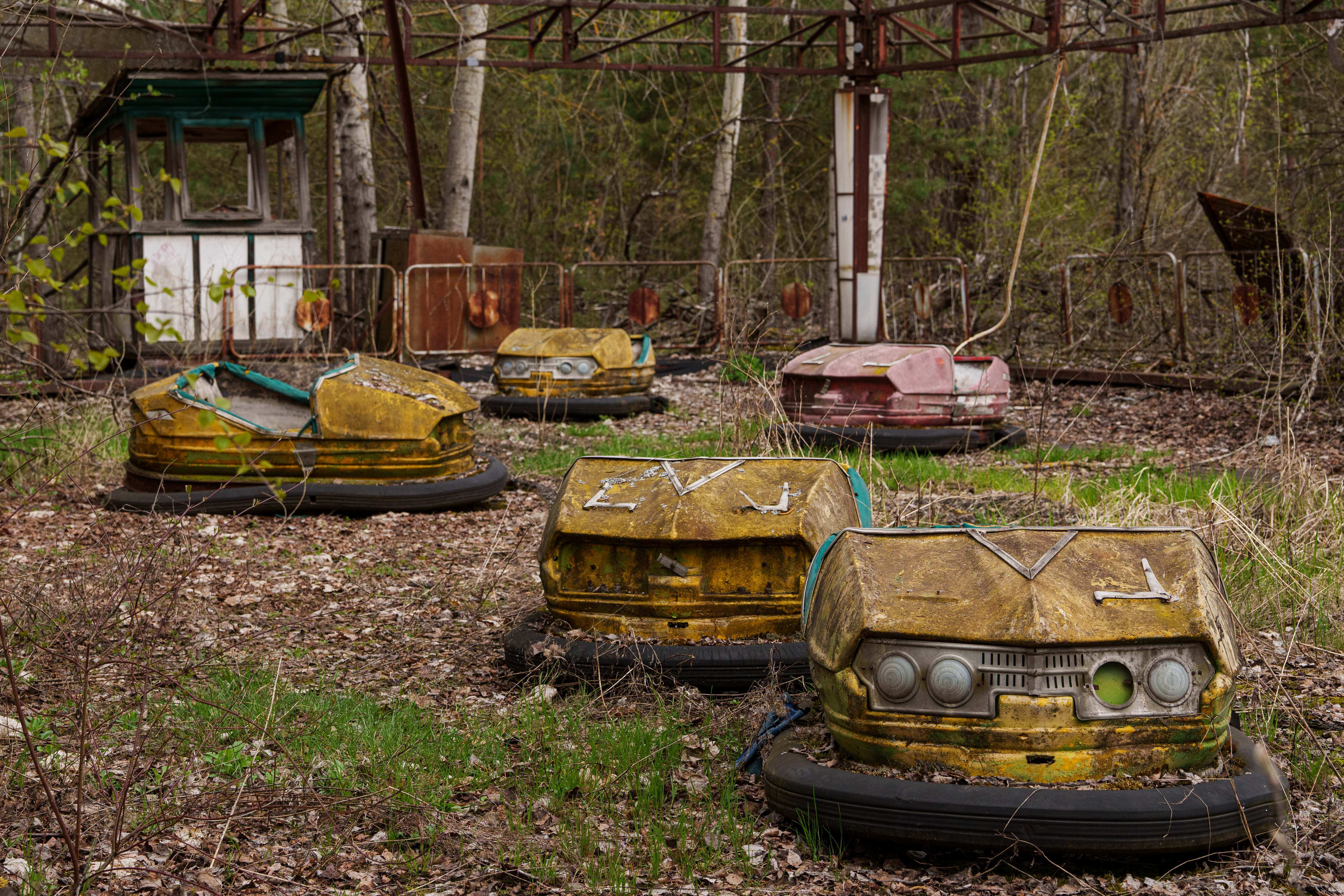 Bumper cars sit idle at an overgrown amusement park in Pripyat, Ukraine, a town left abandoned following the nearby 1986 Chernobyl nuclear disaster