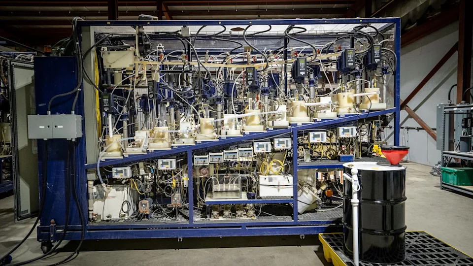 Tailings are mixed with liquids and fed into a series of reactors, like the one pictured here. Microbes then break down the material, releasing metals into a liquid solution.
