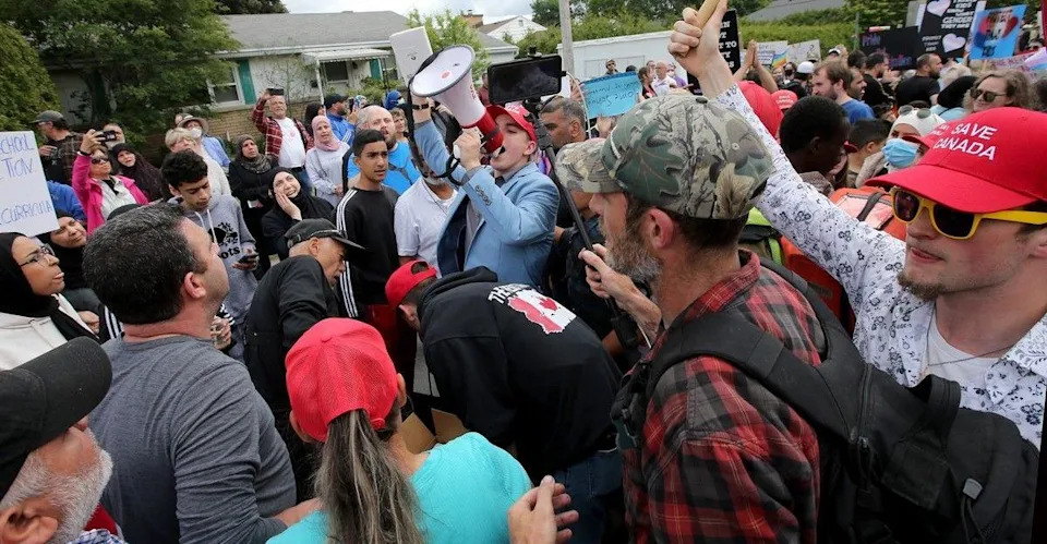  Tempers heat up as protesters and counter-protesters gather near a Broadview Avenue school in June 2023.