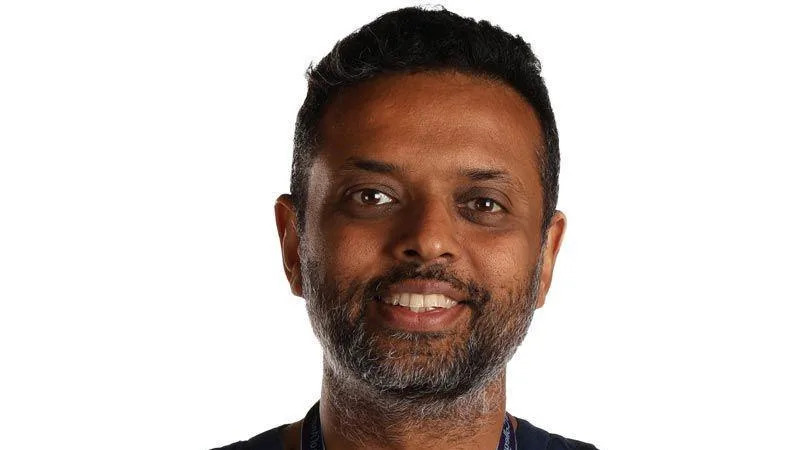 Professor Tonny Veenith - a man with short black hair, a black and grey short beard and moustache is smiling at the camera against a white background