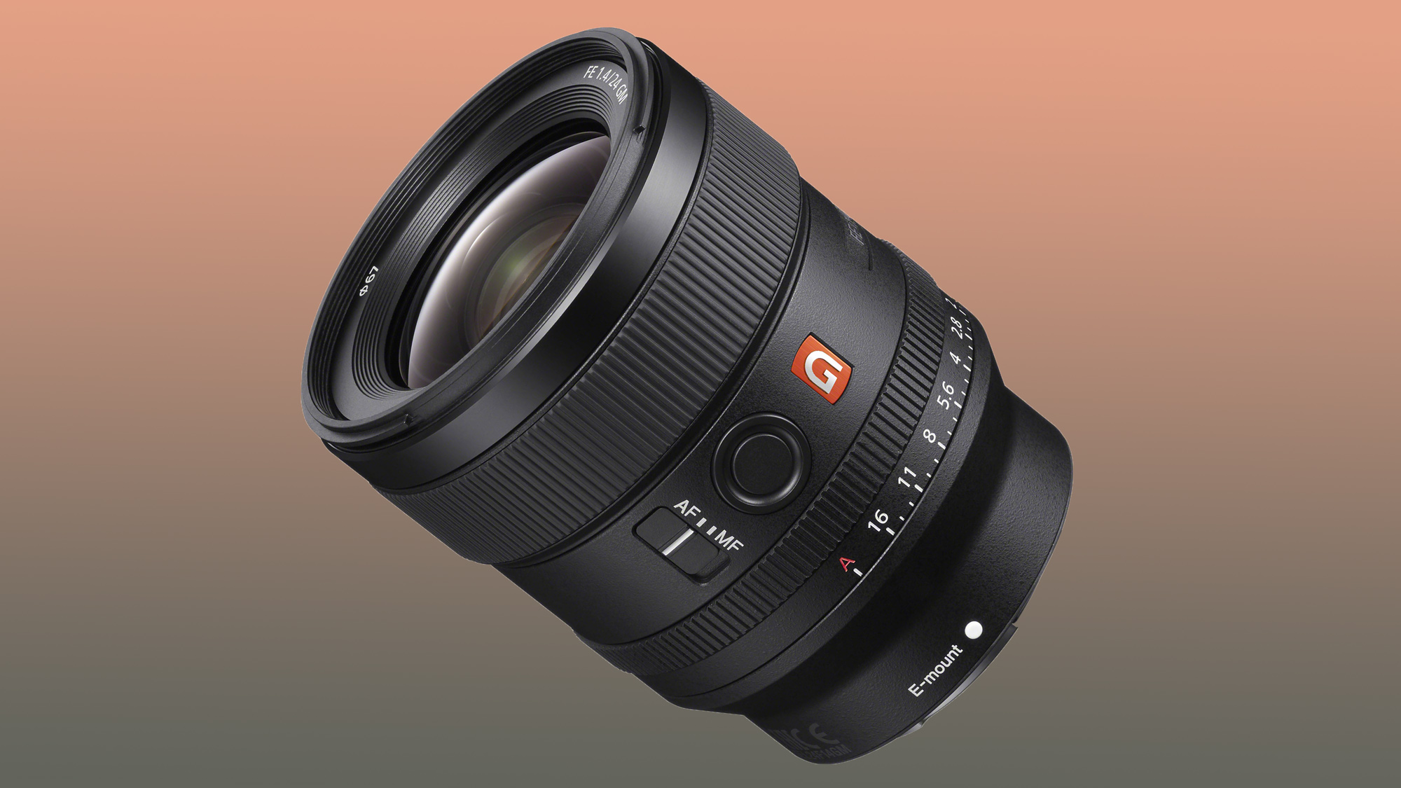 Sony G Master FE 24mm f/1.4 GM camera lens with focus mode switch and aperture ring on a gradient brown-beige background