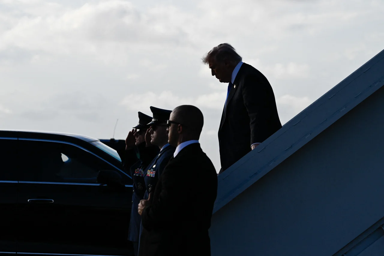 President Donald Trump steps off Air Force One at Palm Beach International Airport in West Palm Beach, Florida, on Friday.