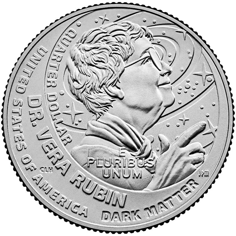 A quarter with a woman looking upwards engraved onto it.