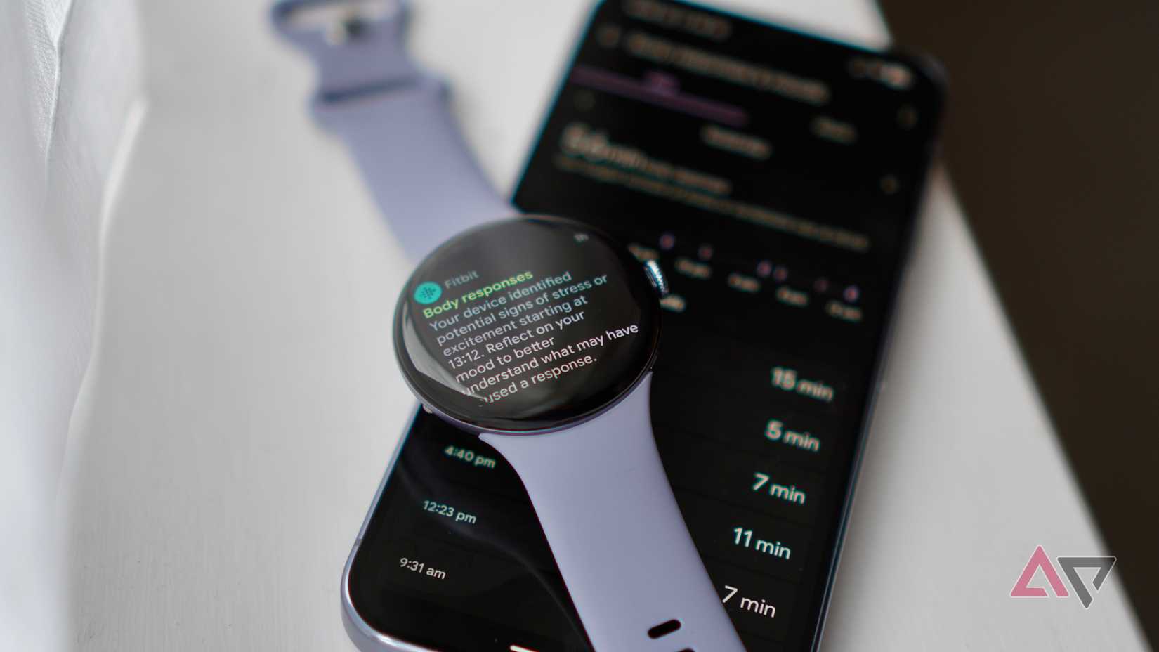 A Fitbit Body Response notification on the Pixel Watch 4, with the Fitbit app