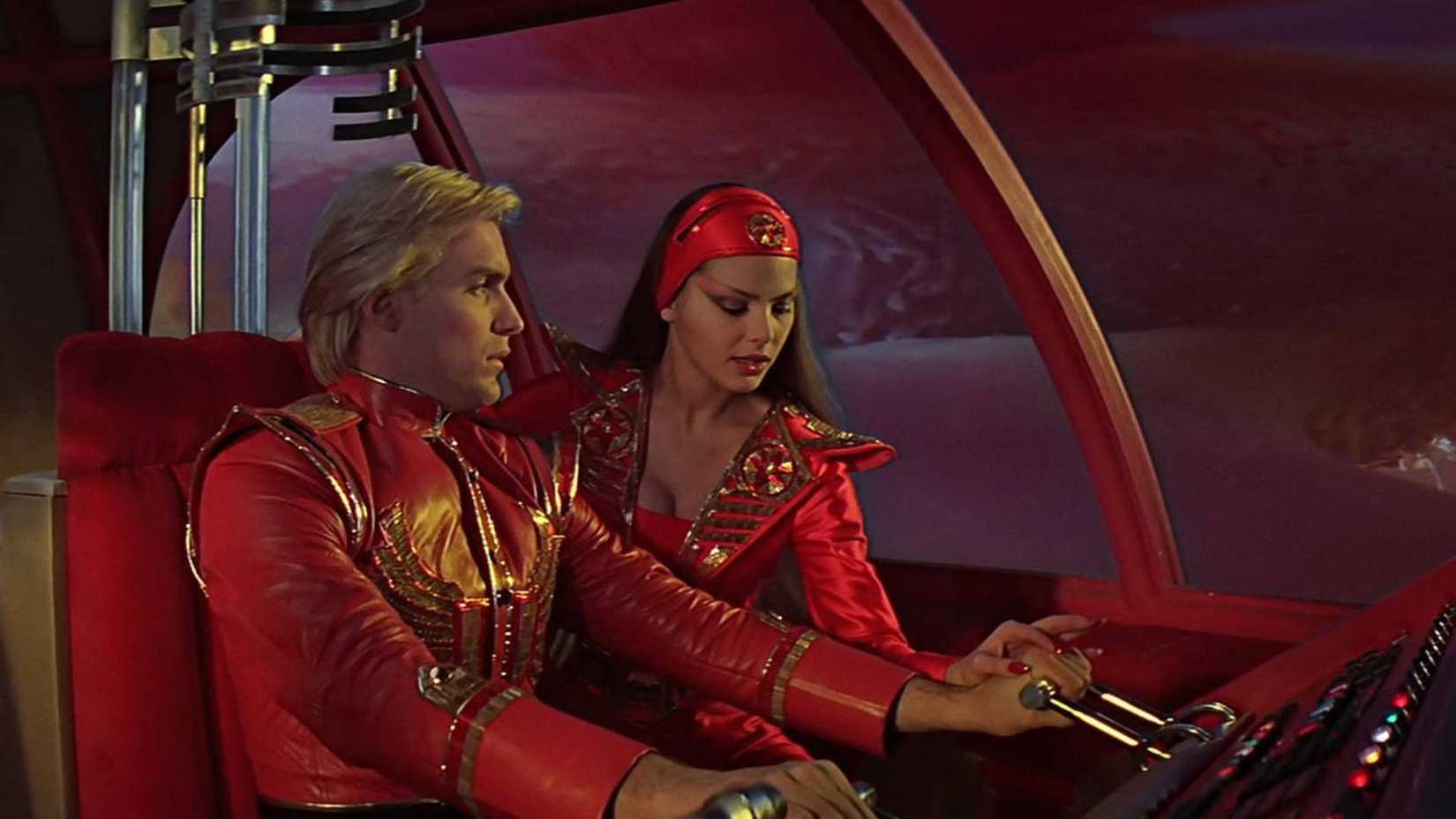 Flash Gordon (Sam J. Jones) operating a ships controls on Planet Mongo.