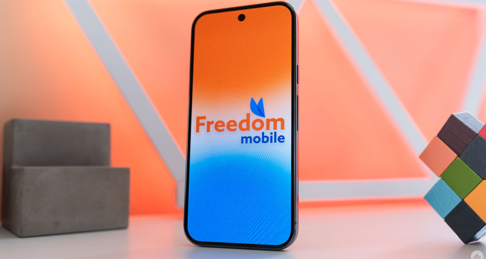 Freedom Mobile logo on a smartphone.