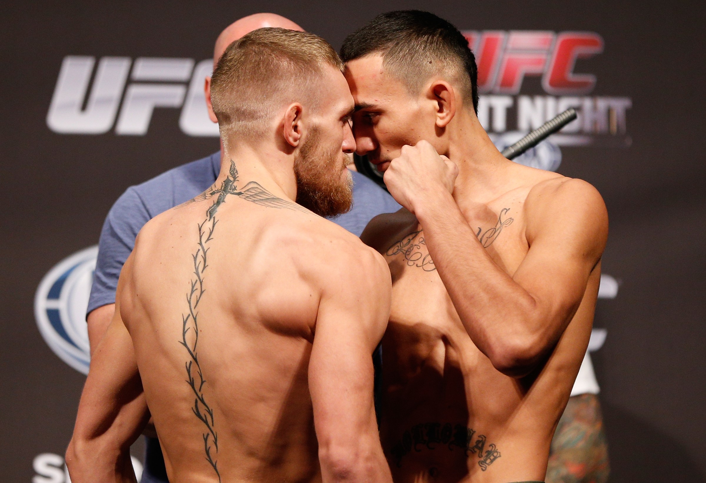 BOSTON, MA - AUGUST 16: (L-R) Opponents Conor McGregor and Max Holloway face off during the UFC weigh-in inside TD Garden on August 16, 2013 in Boston, Massachusetts. (Photo by Josh Hedges/Zuffa LLC/Zuffa LLC via Getty Images)