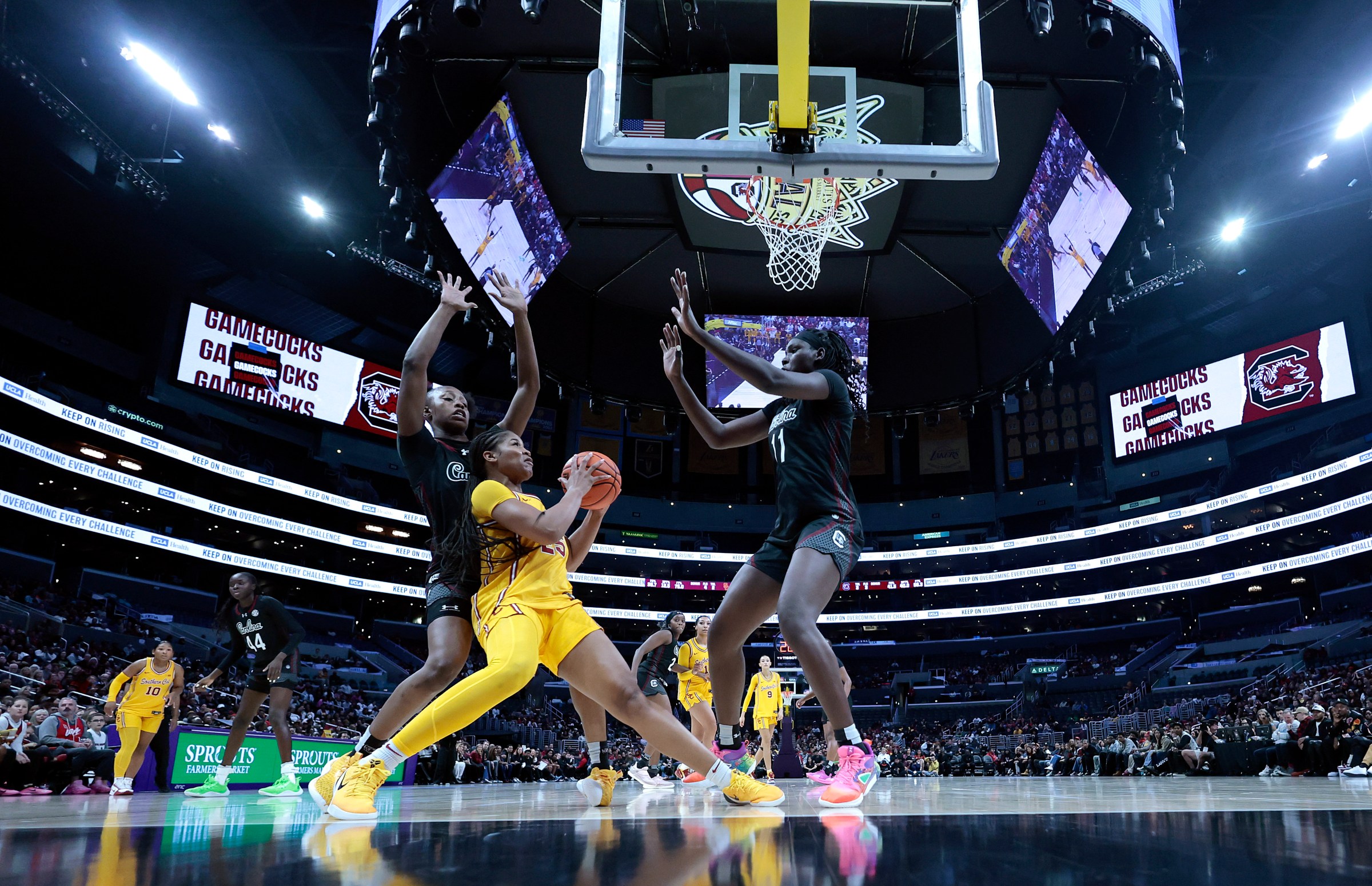 Madina Okot, along with Joyce Edwards, defends Kara Dunn.