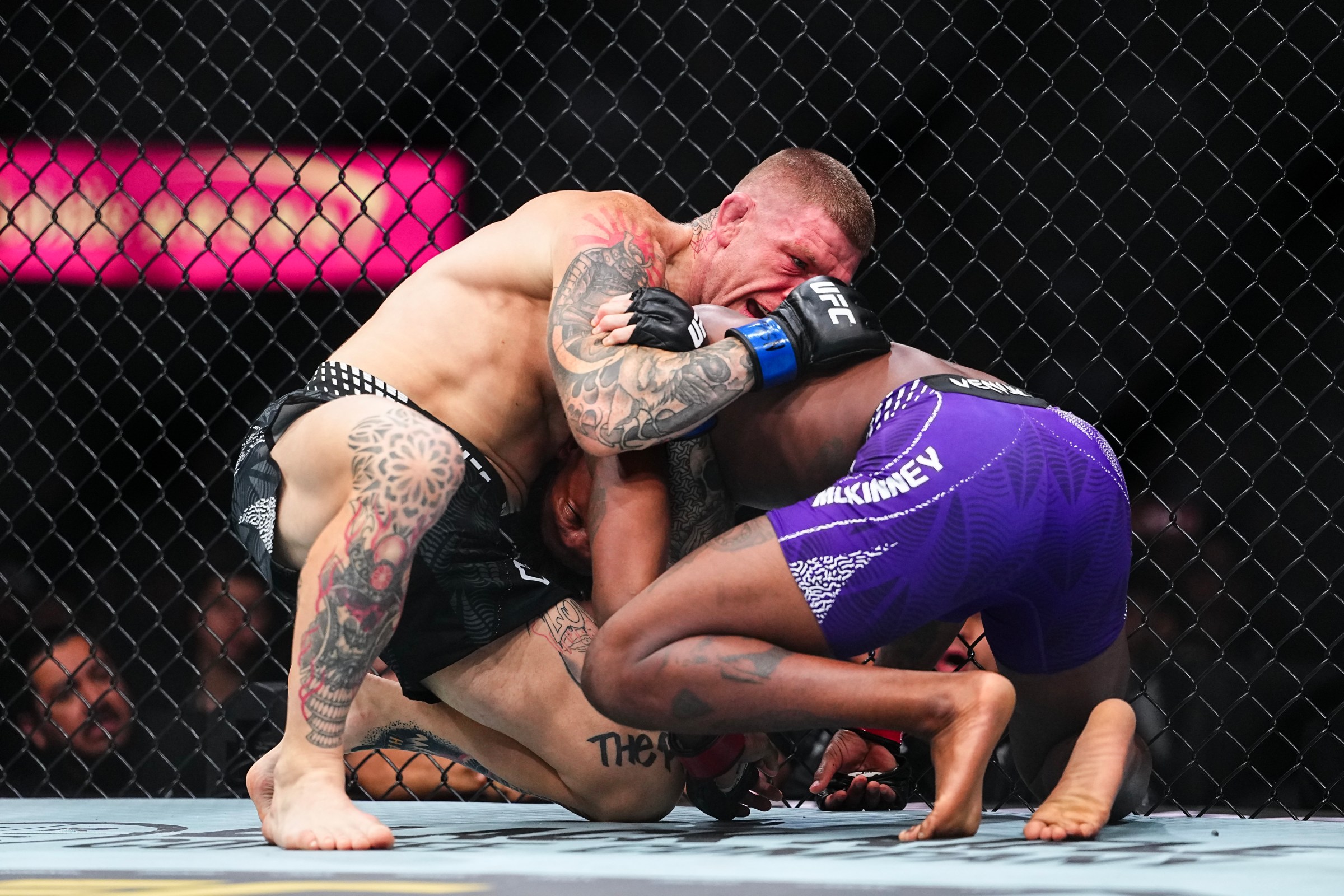 LAS VEGAS, NEVADA - DECEMBER 06: (L-R) Chris Duncan of Scotland grapples with Terrance McKinney in a lightweight fight during the UFC 323 event at T-Mobile Arena on December 06, 2025 in Las Vegas, Nevada. (Photo by Chris Unger/Zuffa LLC)