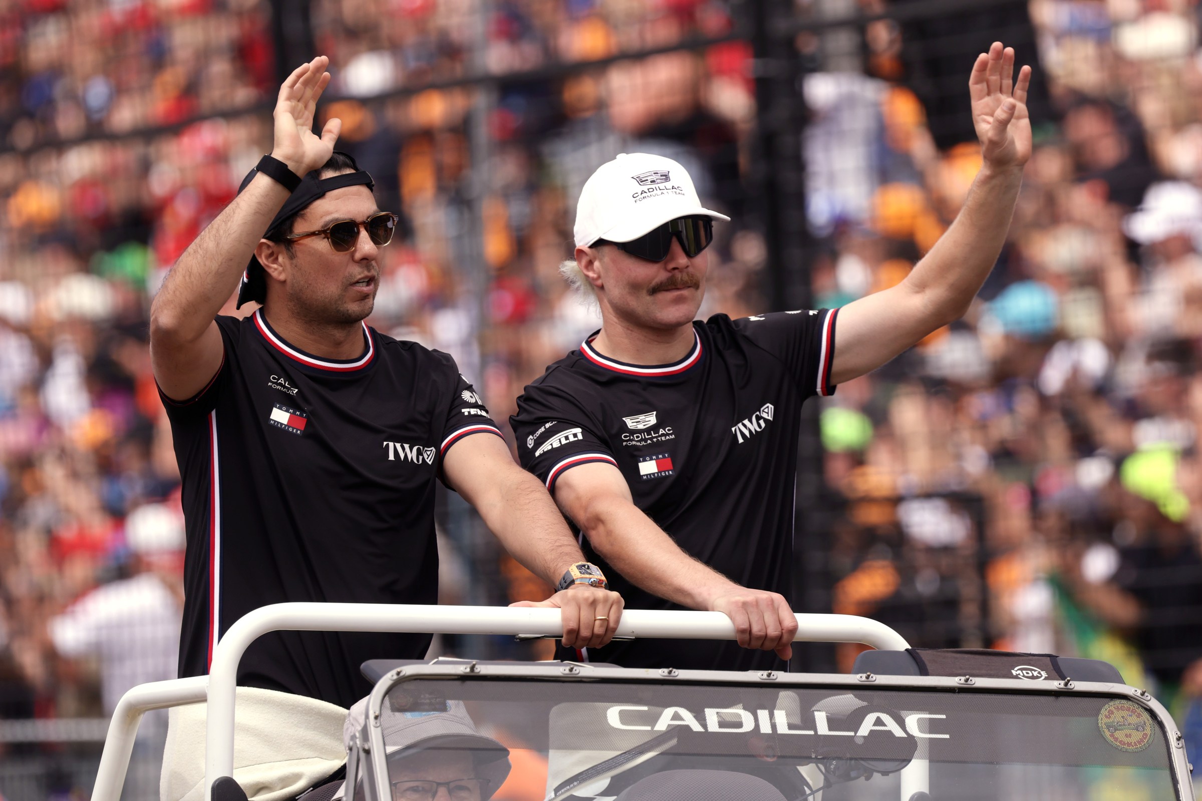 MELBOURNE, AUSTRALIA - MARCH 08: Sergio Perez of Mexico and Cadillac F1 Team and Valtteri Bottas of Finland and Cadillac F1 Team on the drivers parade prior to the F1 Grand Prix of Australia at Albert Park Grand Prix Circuit on March 08, 2026 in Melbourne, Australia. (Photo by Mark Thompson/Getty Images)