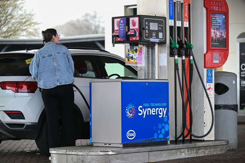 A customer fills up her car at a gas station in Huddersfield, northern England, on March 19, 2026.