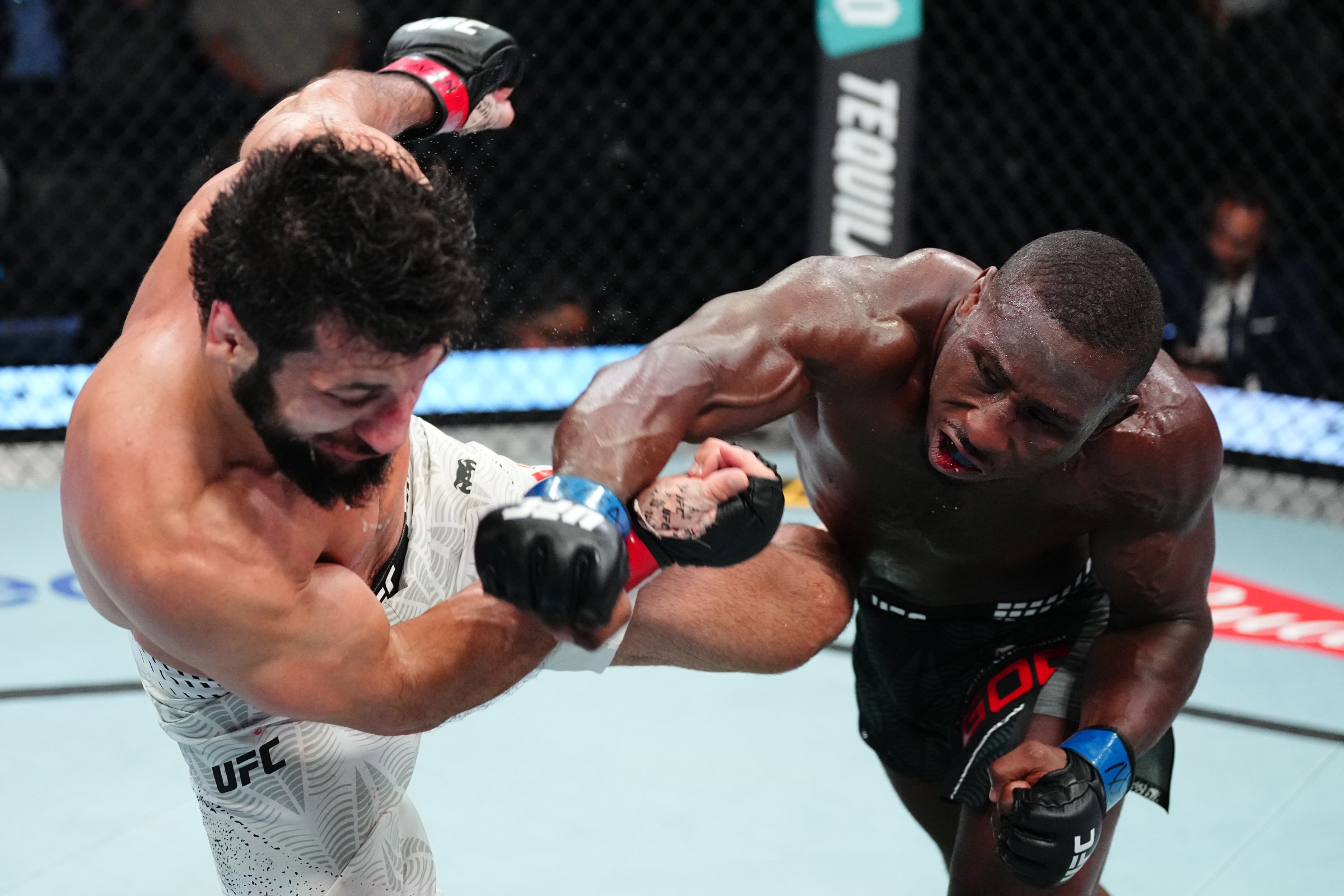 LAS VEGAS, NEVADA - APRIL 04: (R-L) Tresean Gore punches Azamat Bekoev of Russia in a middleweight fight during the UFC Fight Night event at Meta APEX on April 04, 2026 in Las Vegas, Nevada. (Photo by Jeff Bottari/Zuffa LLC)