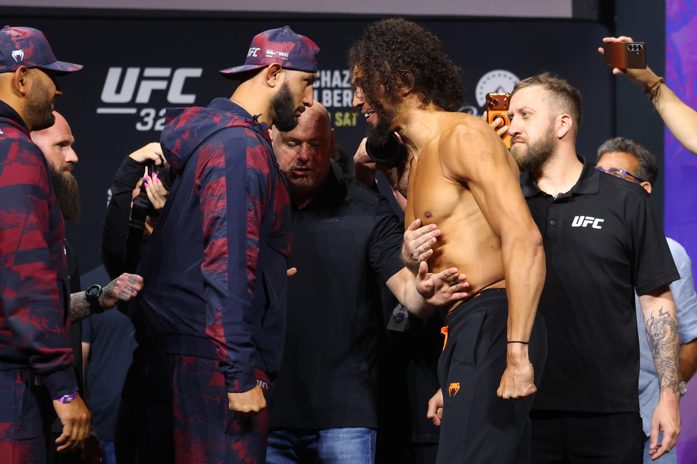 MIAMI, FLORIDA - APRIL 10: (L-R) Opponents Dominick Reyes and Johnny Walker of Brazil face off during the UFC 327 ceremonial weigh-in at Kaseya Center on April 10, 2026 in Miami, Florida. (Photo by Ed Mulholland/Zuffa LLC)