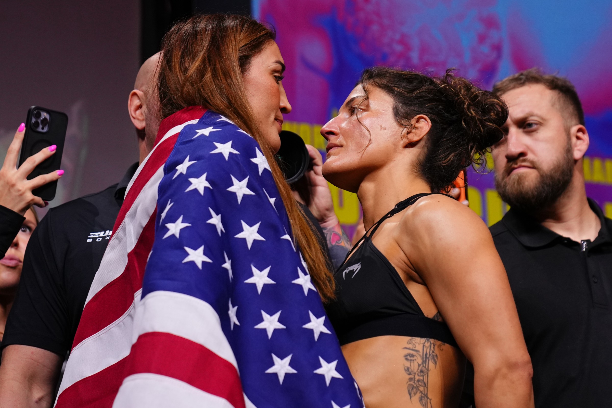 MIAMI, FLORIDA - APRIL 10: (L-R) Opponents Tatiana Suarez and Loopy Godinez of Mexico poses on the scale during the UFC 327 ceremonial weigh-in at Kaseya Center on April 10, 2026 in Miami, Florida. (Photo by Mike Roach/Zuffa LLC)
