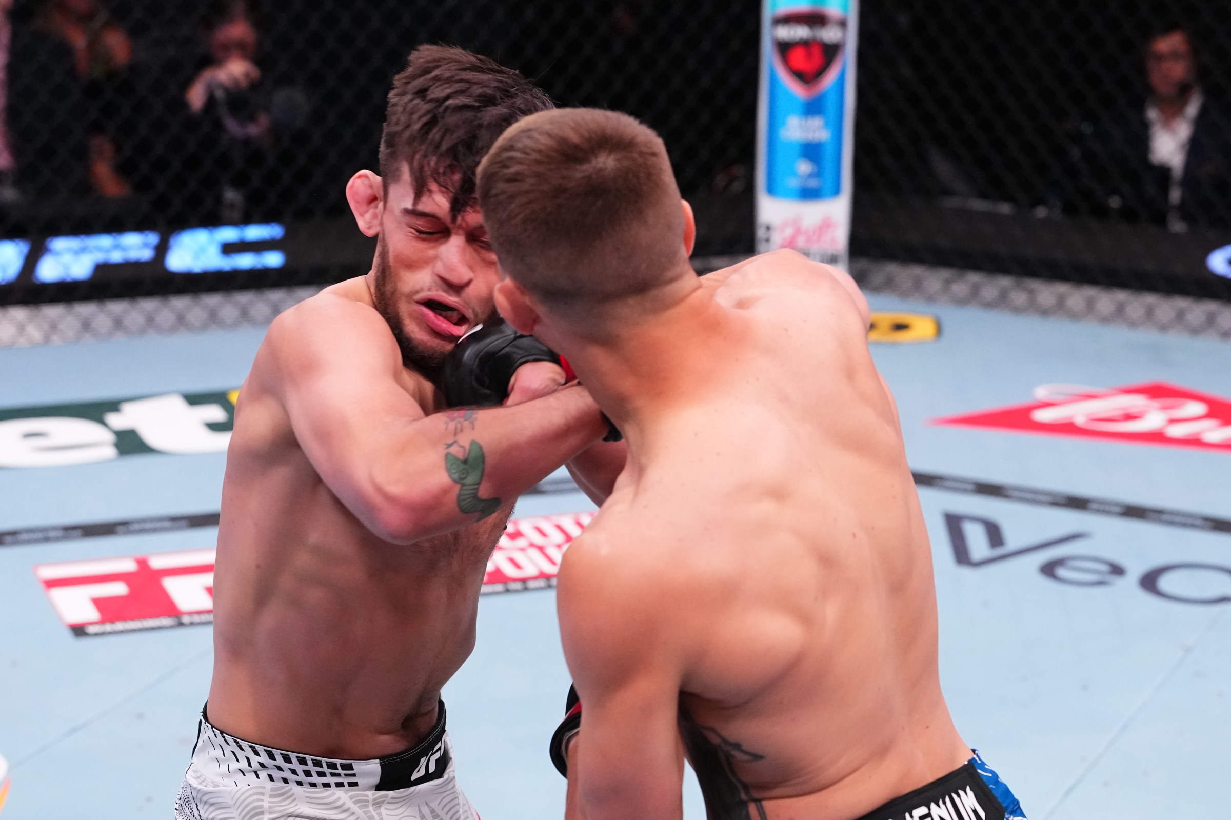 LAS VEGAS, NEVADA - APRIL 25: (R-L) Francis Marshall punches Lucas Brennan in a lightweight fight during the UFC Fight Night event at Meta APEX on April 25, 2026 in Las Vegas, Nevada. (Photo by Jeff Bottari/Zuffa LLC)