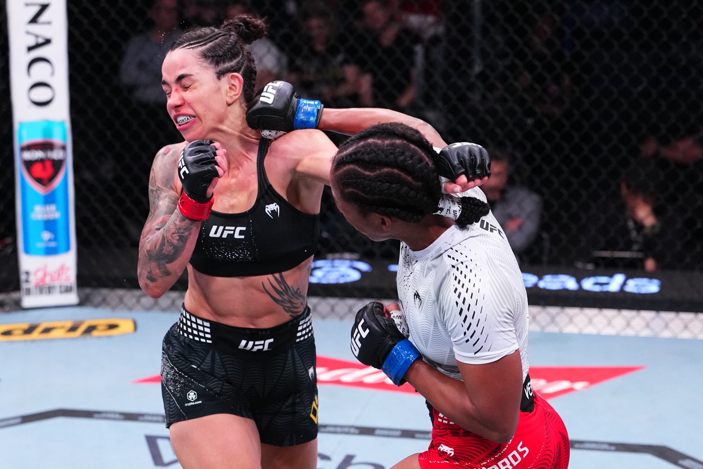 LAS VEGAS, NEVADA - APRIL 25: (R-L) Joselyne Edwards of Panama punches Norma Dumont of Brazil in a bantamweight fight during the UFC Fight Night event at Meta APEX on April 25, 2026 in Las Vegas, Nevada. (Photo by Jeff Bottari/Zuffa LLC)
