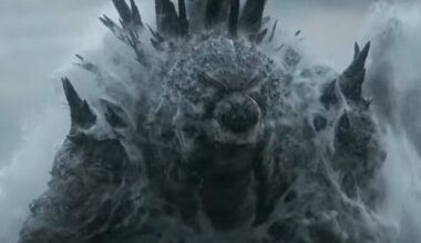 gigantic godzilla monster rising out of the ocean with a great roar