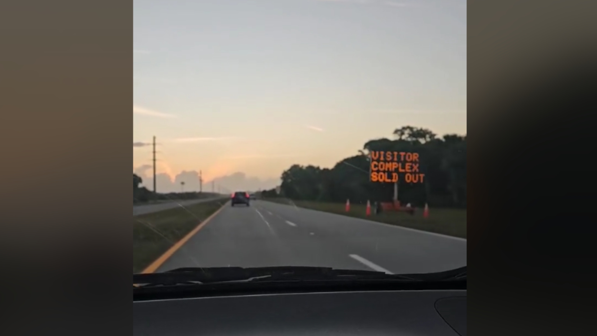 sign by the side of the road saying the visitor complex is sold out.