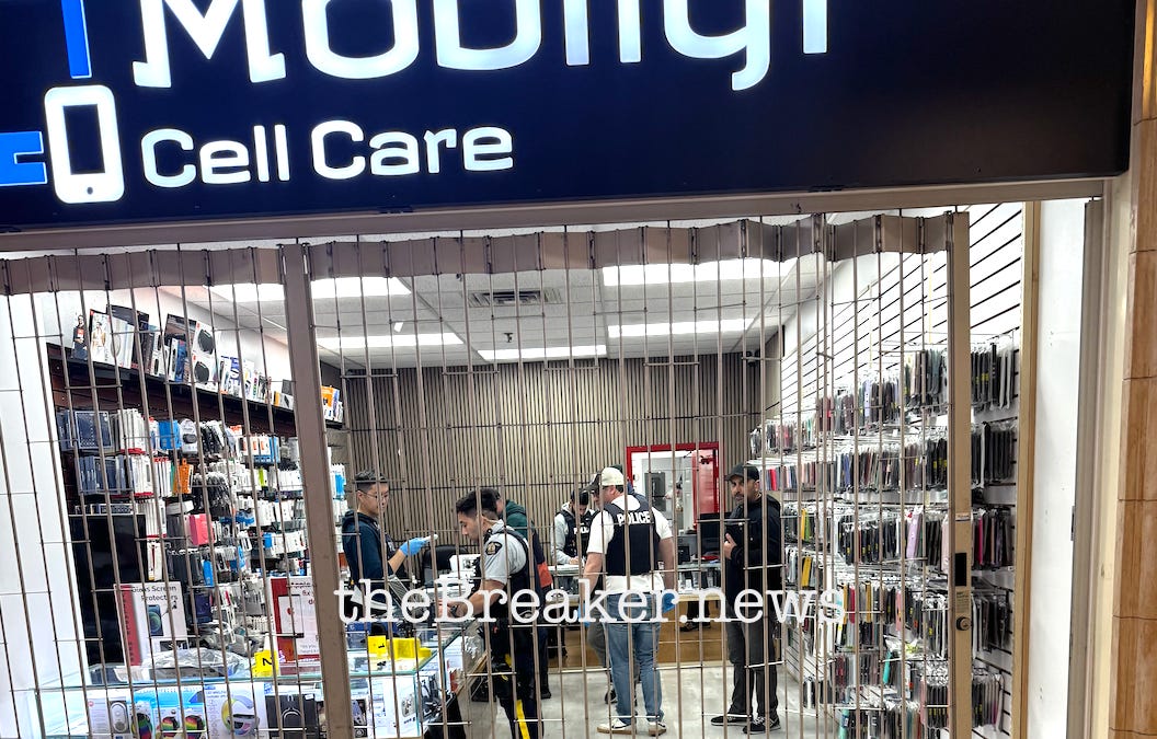 Police search Vancouver cell phone repair store
