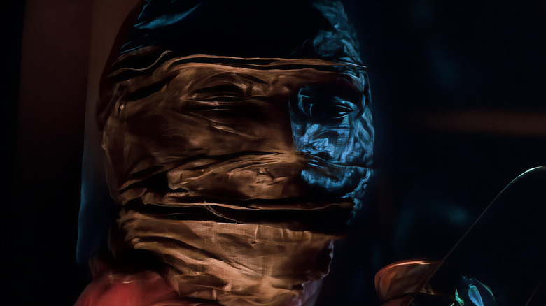 A close-up of a creepy scarecrow