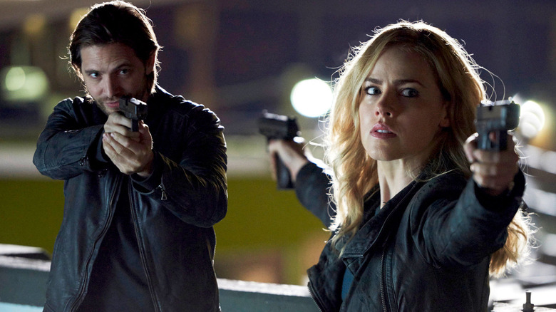 James Cole and Cassie Railly in a stand-off on the Syfy series 