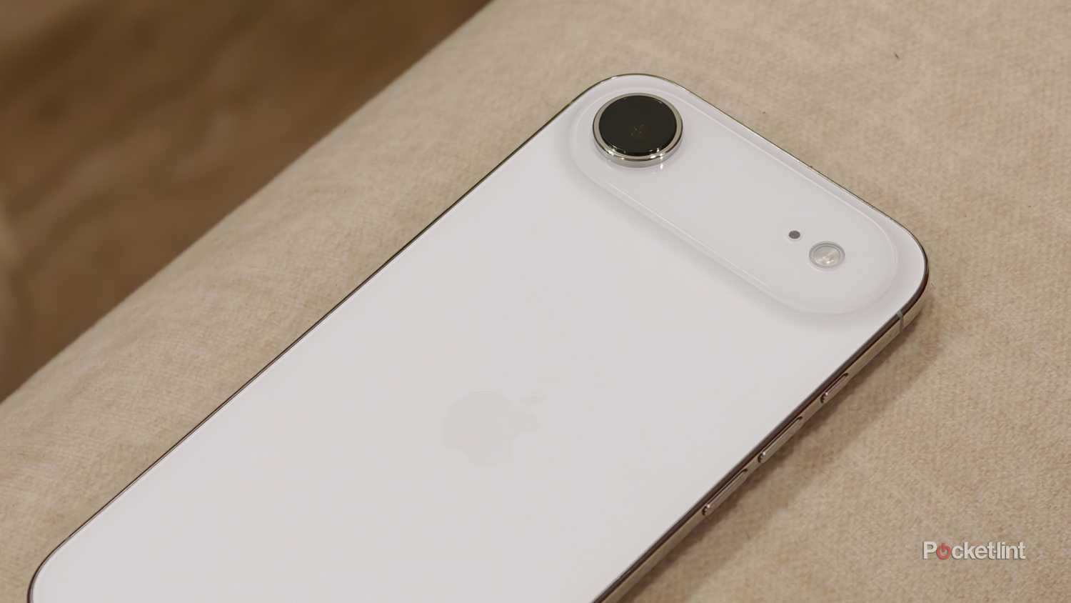 iPhone Air on an off-white sofa showing the back camera bar