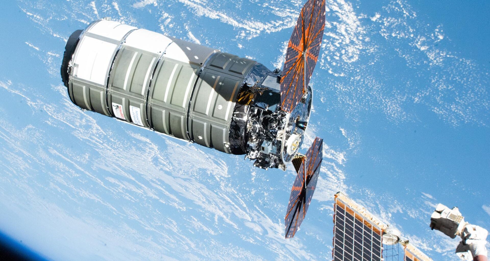 Northrop Grumman's Cygnus XL cargo spacecraft, carrying over 11,000 pounds of new science experiments, lab hardware, and crew supplies, is pictured moments before its capture with the Canadarm2 robotic arm following its approach and rendezvous with the International Space Station.