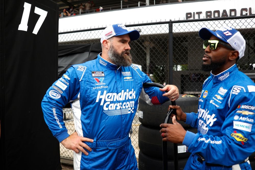 Jason Kelce speaks with Hendrick Motorsports pit crew member