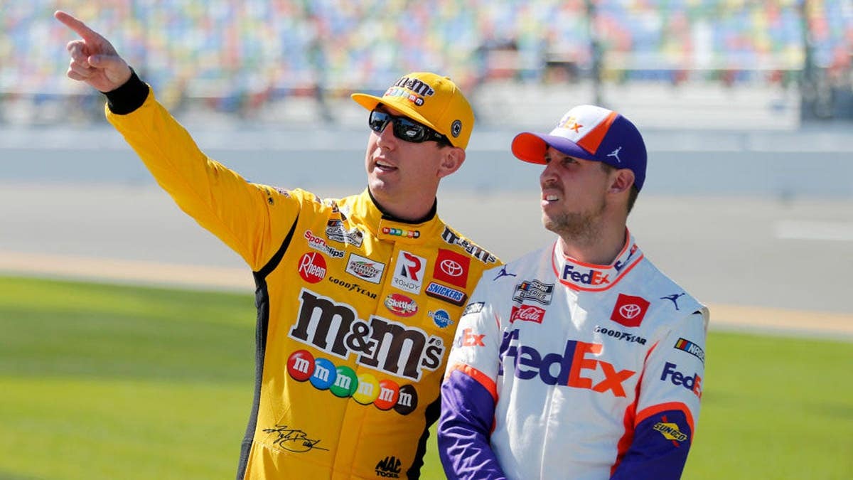Kyle Busch and Denny Hamlin talking during NASCAR qualifying at Daytona International Speedway