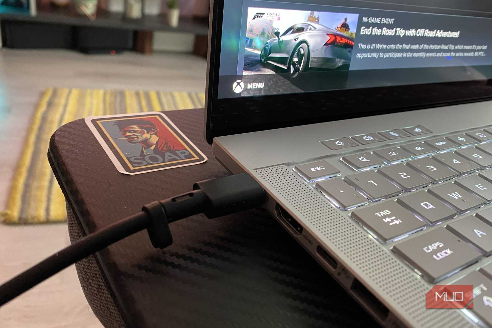 USB-C cable connected to a gaming laptop