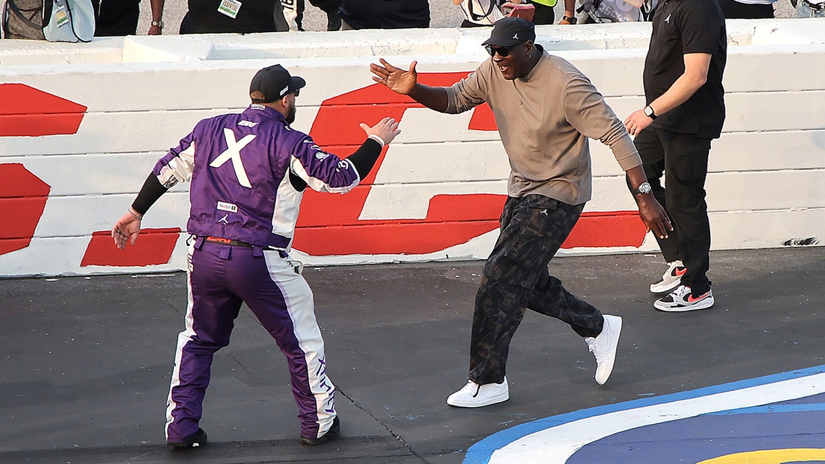 Michael Jordan celebrating with Tyler Reddick at Darlington Raceway