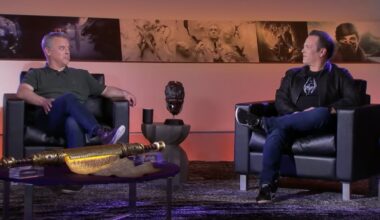 Pete Hines speaks with Phil Spencer on stage.