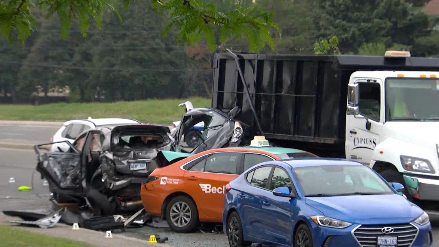 A MiWay bus at a busy intersection in Mississauga, highlighting the area of the crash.