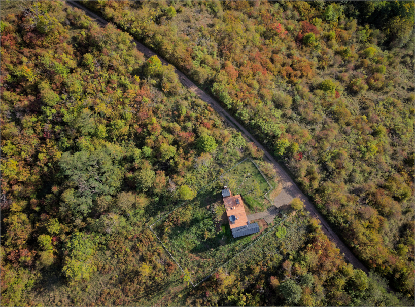 prefabricated timber micro-cabin extends living into the hungarian landscape - 1