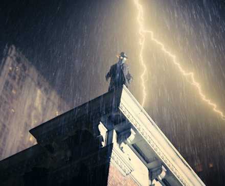 The Spider (Nic Cage) stands on a rooftop with lighting forking behind him in Spider-Noir