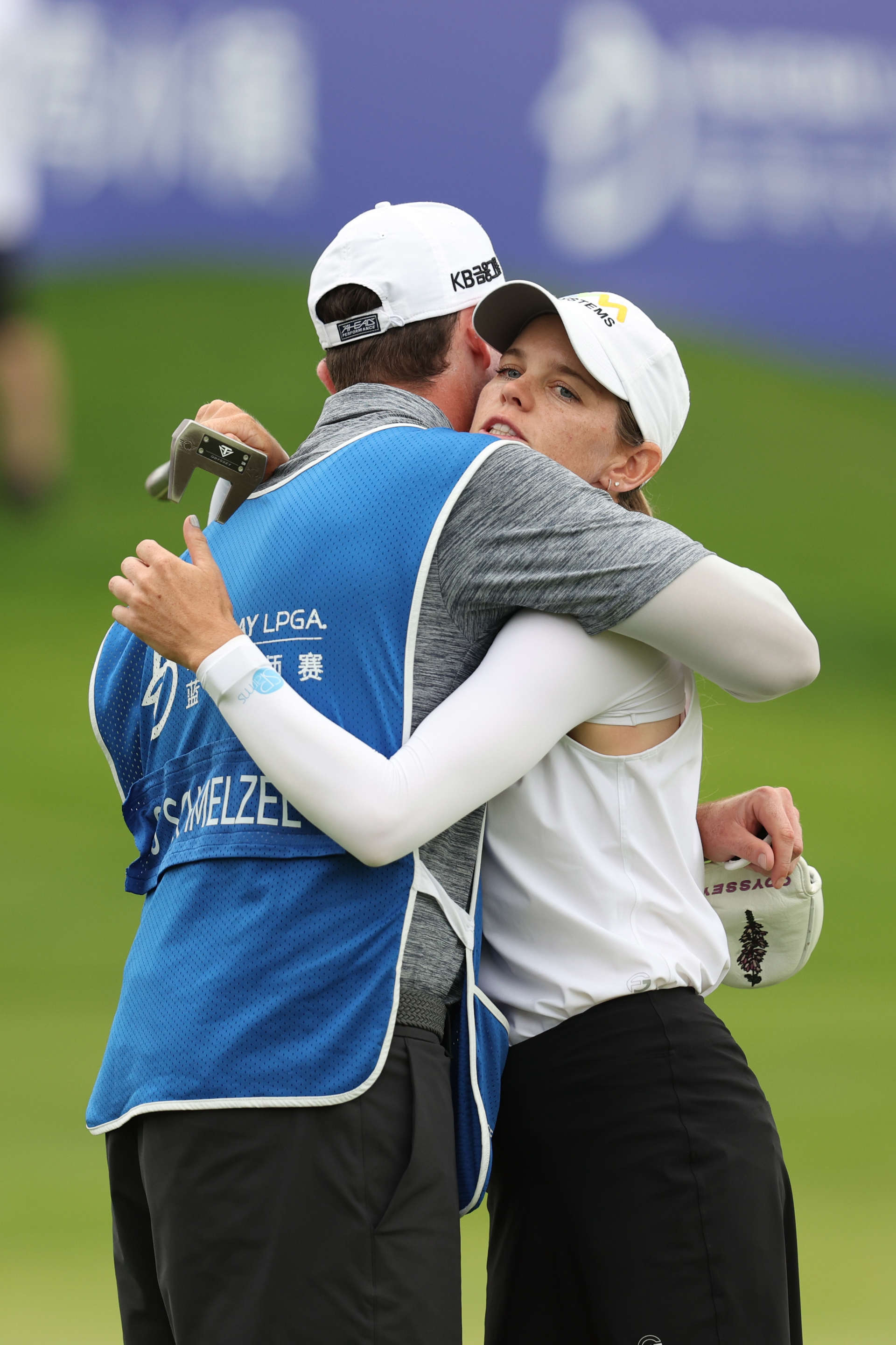 HAINAN ISLAND, CHINA - MARCH 09: Sarah Schmelzel of The United States hugs with her caddie on 18th green after finish the third round of the Blue Bay LPGA at Jian Lake Blue Bay Golf Course on March 09, 2024 in Hainan Island, Hainan. (Photo by Zhizhao Wu/Getty Images)