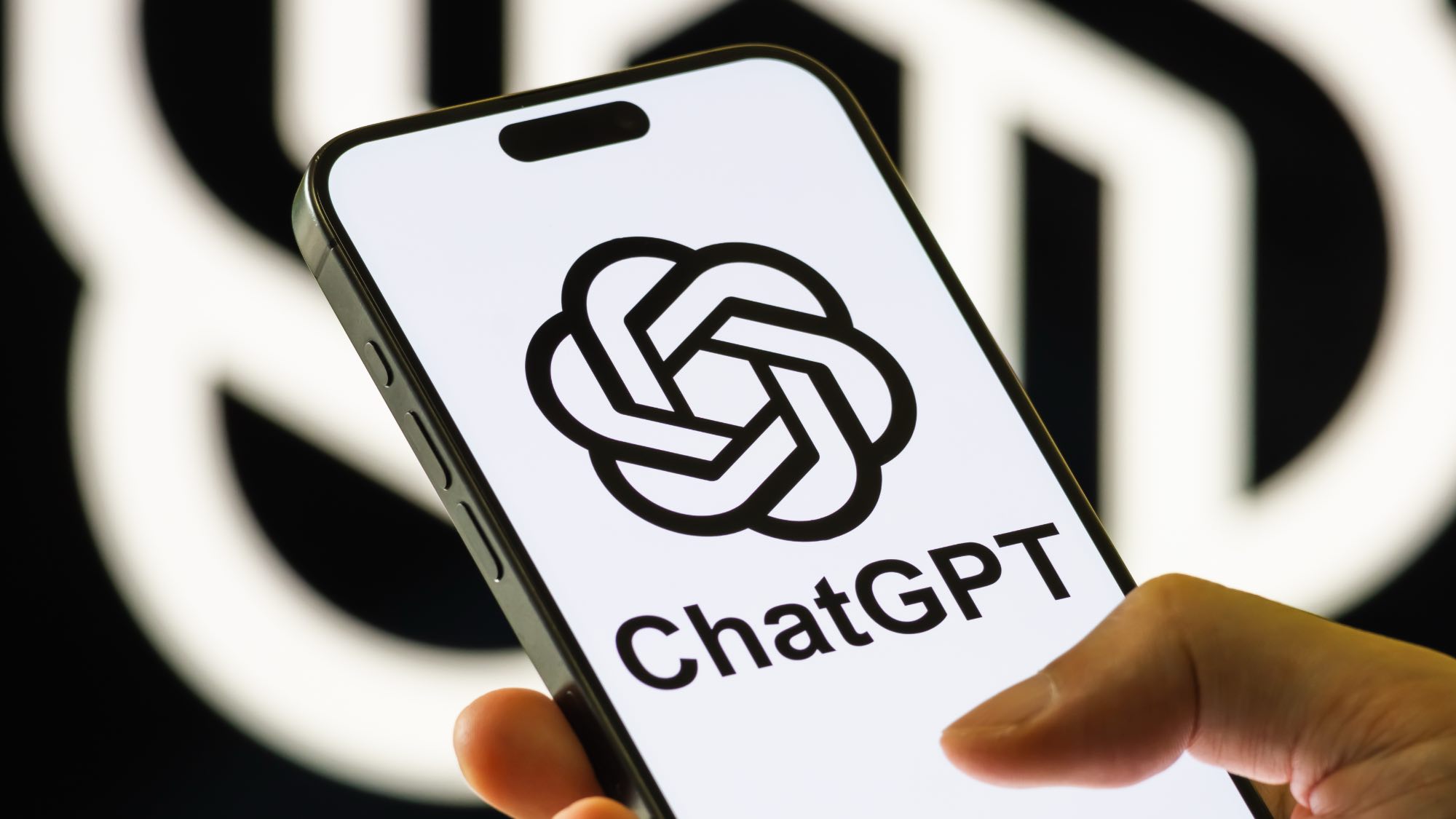ChatGPT logo on iPhone in person's hand