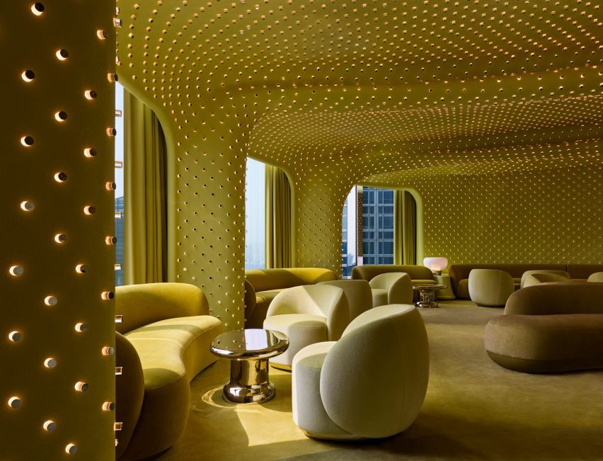 Green bar interior with thousands of tiny lights dotting the curved walls and ceiling