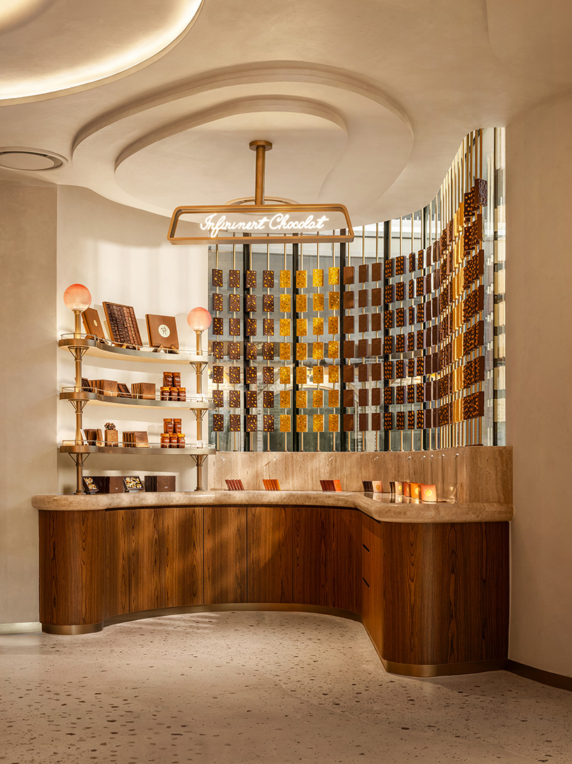 curved wood, rattan, and macaron displays frame a tropical french pâtisserie in singapore - 9