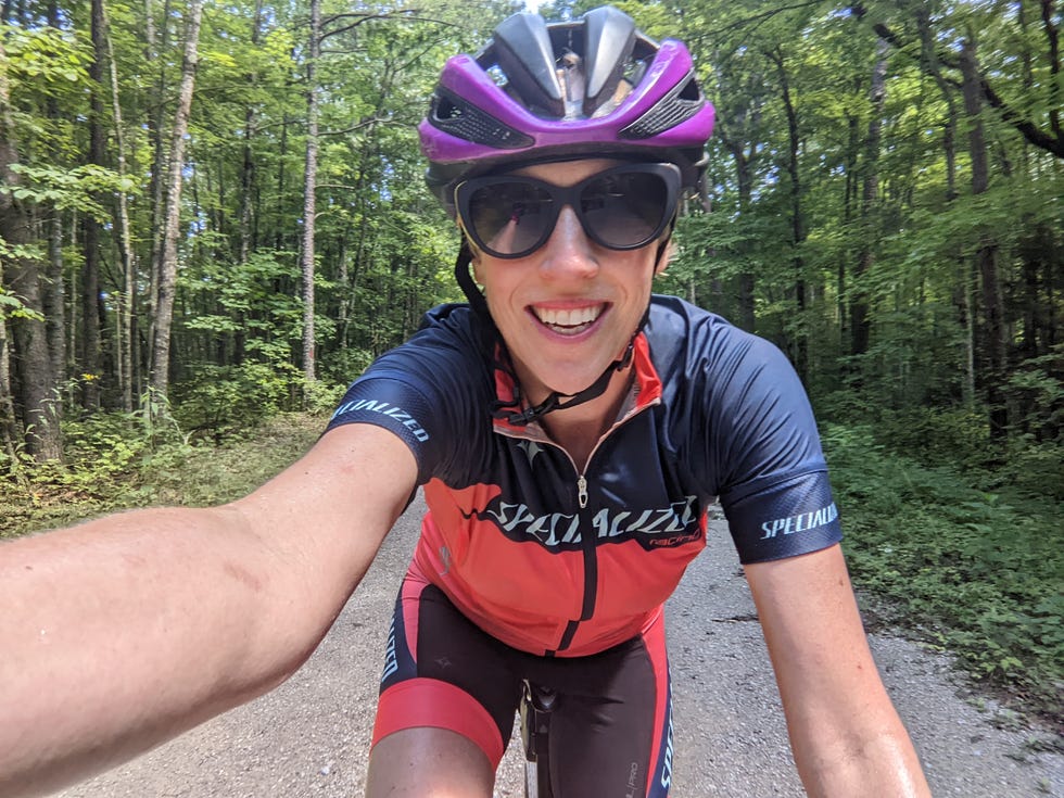 ac taking a selfie on a bike