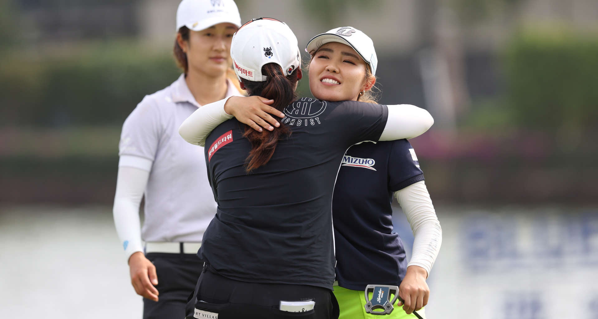 HAINAN ISLAND, CHINA - MARCH 10: Ayaka Furue of Japan hugs with Hye-Jin Choi of Republic of Korea on 18th hole during the final round of the Blue Bay LPGA at Jian Lake Blue Bay Golf Course on March 10, 2024 in Hainan Island, Hainan. (Photo by Zhizhao Wu/Getty Images)
