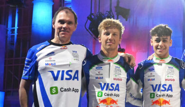 Alan Permane, Team Principal of Visa Cash App Racing Bulls, Liam Lawson of New Zealand and Visa Cash App Racing Bulls, Arvid Lindblad of Great Britain and Visa Cash App Racing Bulls and Peter Bayer, CEO of Visa Cash App Racing Bulls pose for a photo with their cars new livery on stage during the Visa Cash App Racing Bulls season launch at Michigan Central Station on January 15, 2026 in Detroit, Michigan. (Photo by Rudy Carezzevoli/Getty Images) // Getty Images / Red Bull Content Pool //