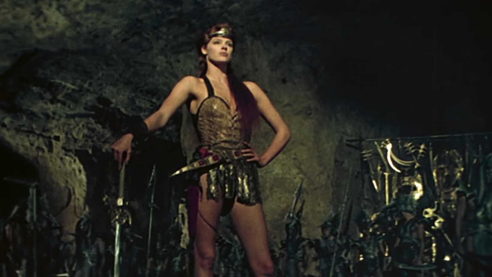 Red Sonja (Brigitte Nielsen) posing with a sword from original 1985 trailer