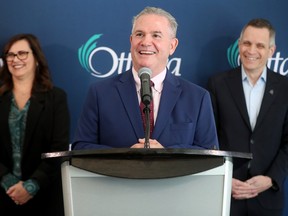 Ottawa Mayor Mark Sutcliffe (right) and city manager, Wendy Stephenson (left), announced Rick Leary (centre) as the new general manager of transit services Friday at City Hall.