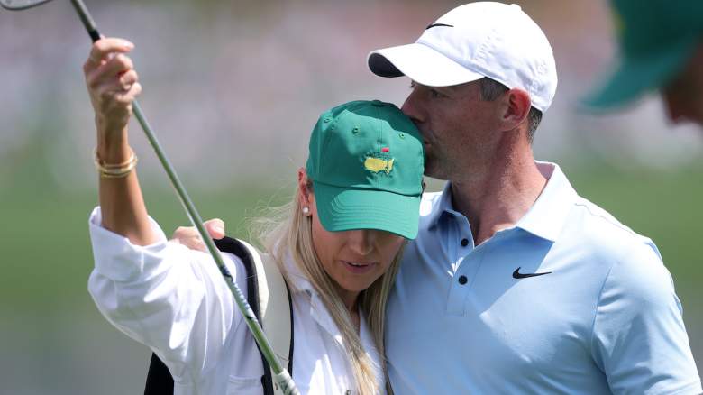 Rory McIlroy hugs wife Erica Stoll after Masters win as fans react to their emotional but subdued celebration