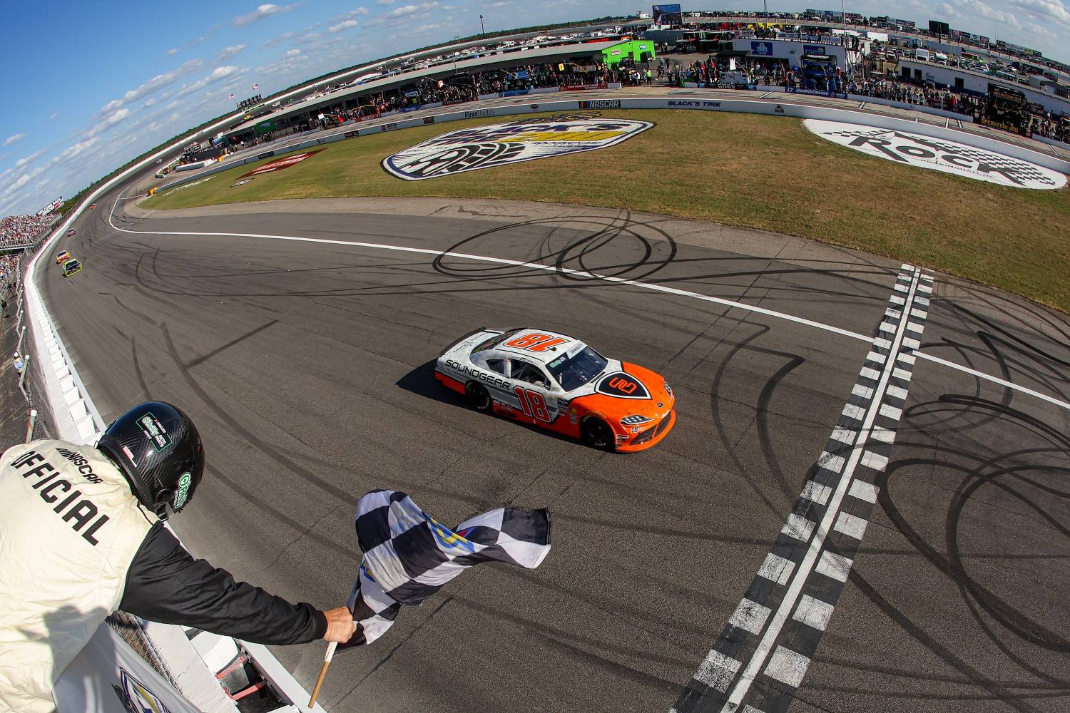 William Sawalich, driver of the #18 Soundgear Toyota, takes the checkered flag to win the NASCAR O'Reilly Auto Parts Series North Carolina Education Lottery 250 Presented by Black's Tire at Rockingham Speedway on April 04, 2026 in Rockingham, North Carolina. (Photo by James Gilbert/Getty Images)