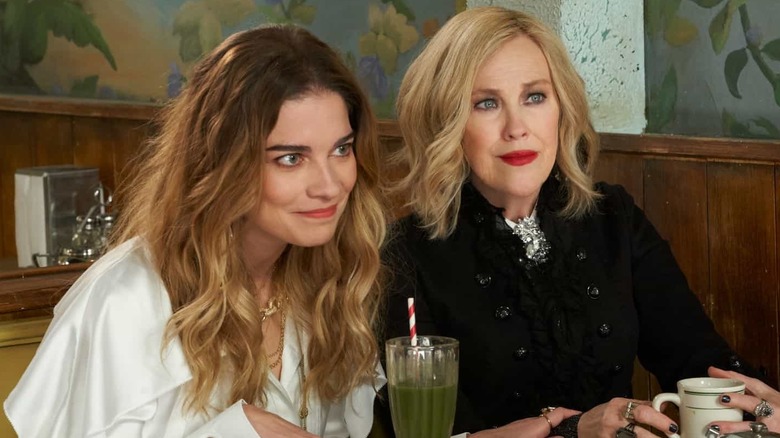 Alexis and Moira sitting in a diner in Schitt's Creek